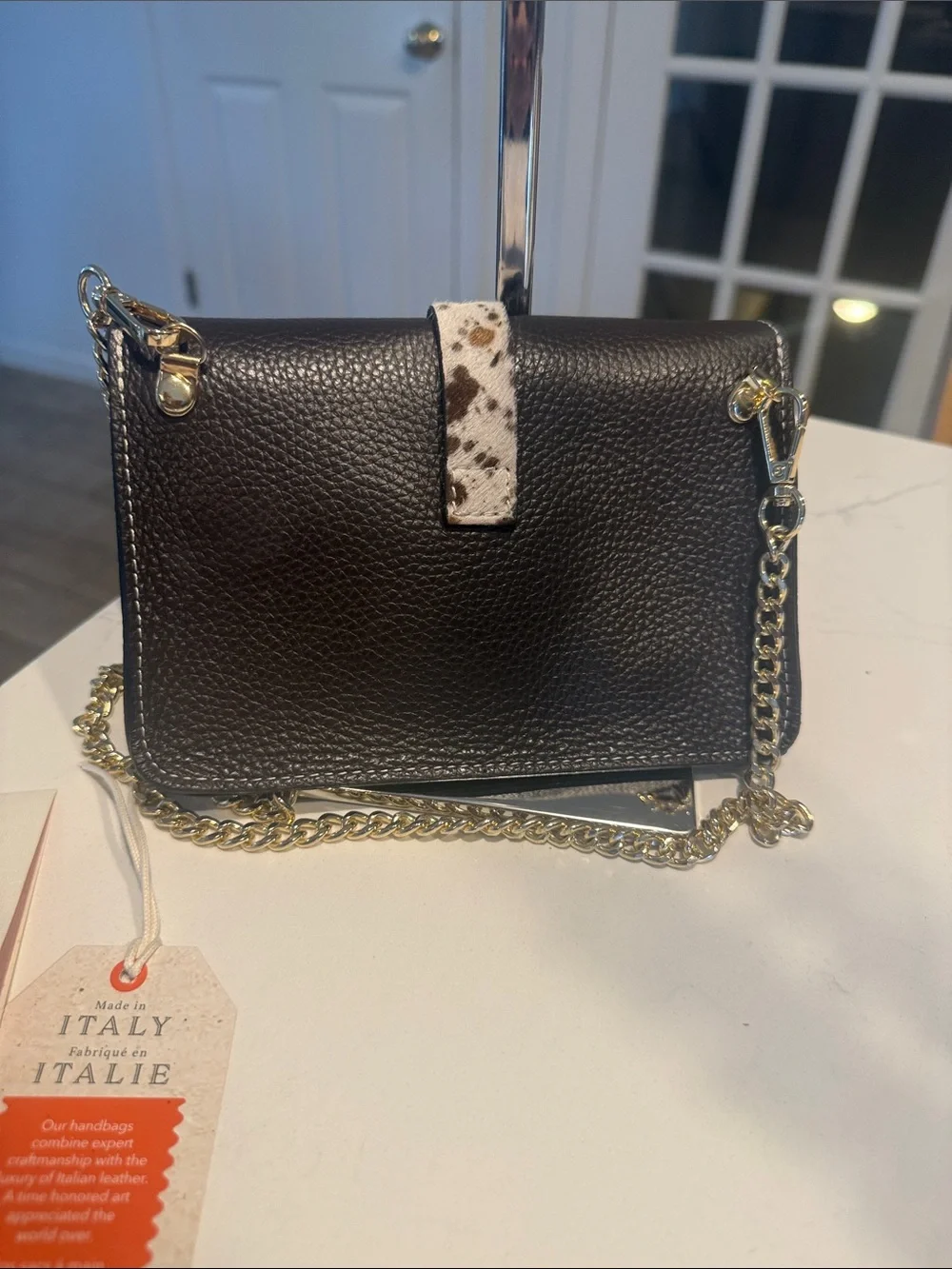 Black Pebbled Leather Crossbody Bag with Speckled Tab and Gold Chain